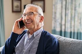 Senior man smiling while talking on the phone